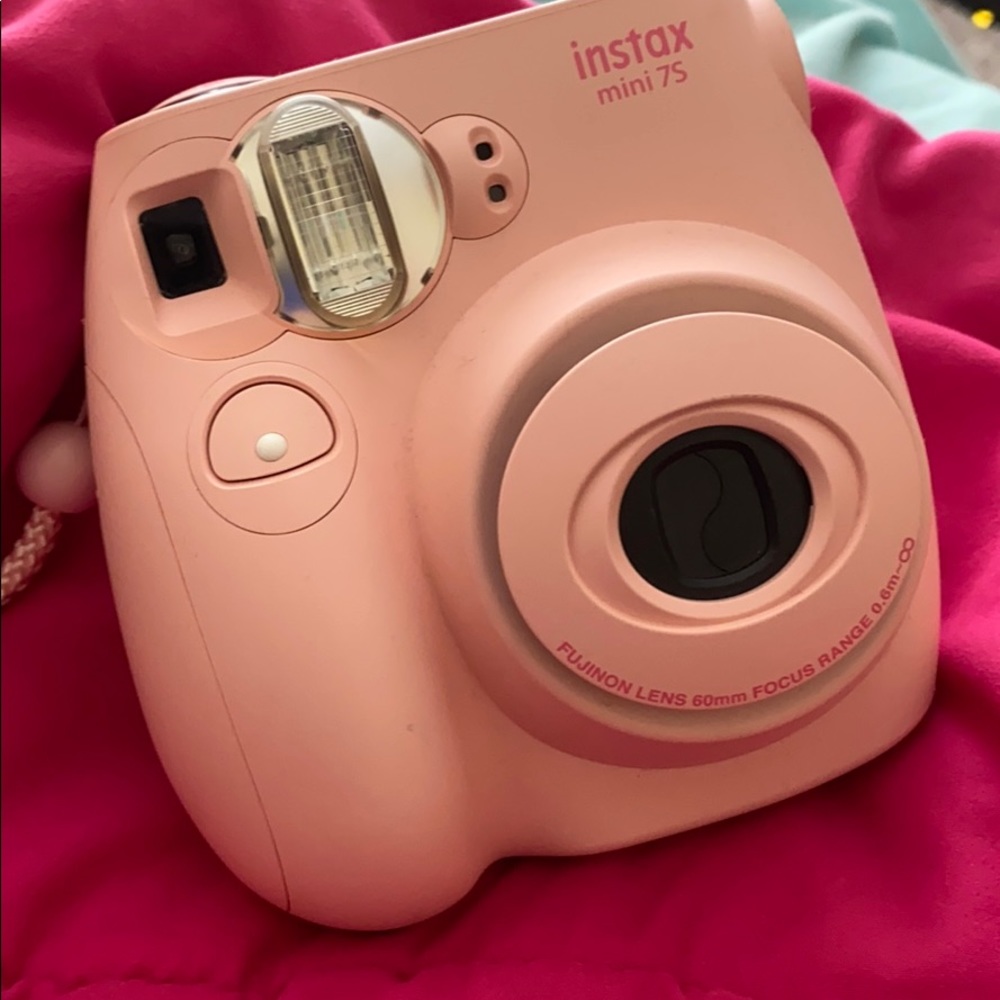 Baby pink Polaroid camera.